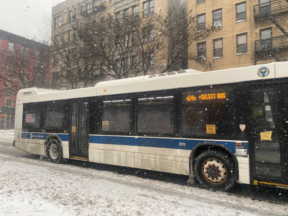 An MTA bus with chains on its wheels